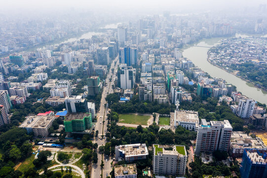 Aerial view of Gulshan 2 featuring dense urban development, high-rise buildings, lush green parks, and a winding river in Dhaka, Dhaka Division, Bangladesh.