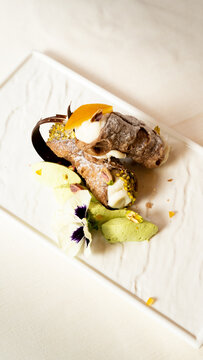 Sicilian cannoli with ricotta, pistachio and candied orange
