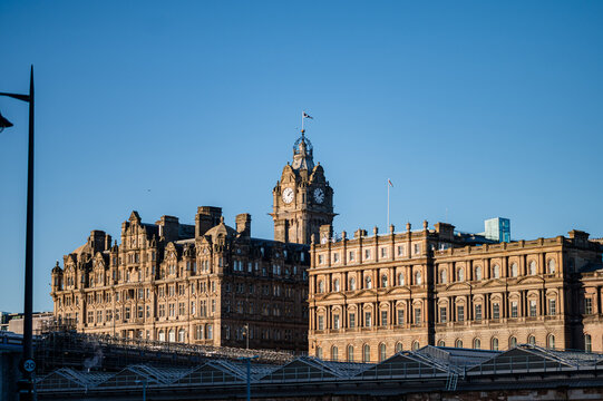 Edinburgh clock tower and historic building under blue sky