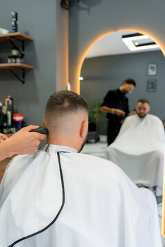 Barber use electric shaver for precision haircut