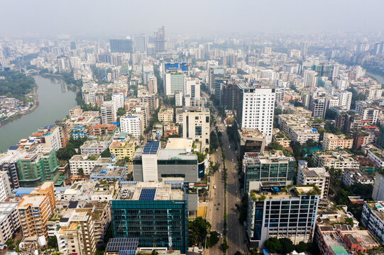 Aerial view of Gulshan 2 featuring modern high-rise office buildings, dense urban infrastructure, and a winding river flowing through the cityscape in Dhaka, Dhaka Division, Bangladesh.