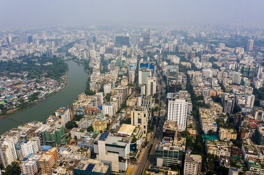 Aerial view of the dense urban landscape of Gulshan 2, featuring high-rise buildings, modern architecture, a winding river, and busy streets in Dhaka, Dhaka Division, Bangladesh.