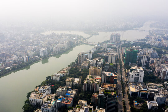 Aerial view of Gulshan 2 area, showing the lake, modern high-rise buildings, dense urban development, and city streets under a hazy sky in Dhaka, Dhaka Division, Bangladesh.