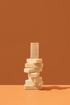 Cream filled wafer cookie stack on orange background