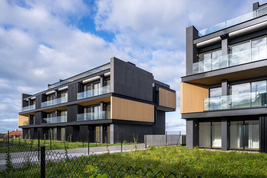 Modern hillside residential apartment complex with glass balconies