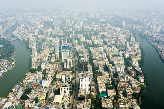 Aerial view of Gulshan 2 featuring dense high-rise buildings and commercial structures surrounded by a winding river in Dhaka, Dhaka Division, Bangladesh.