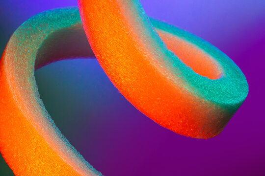 Abstract colorful foam loop with neon gradient background
