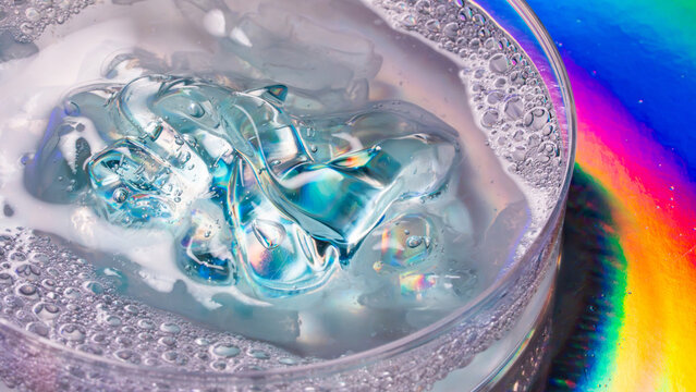 Macro petri dish with iridescent gel and bubbles