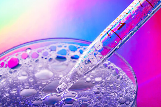 Macro petri dish with pipette and colorful liquid