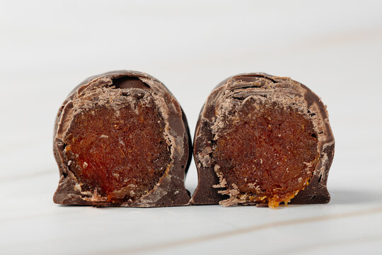 Chocolate-covered dried fruit strips with caramel filling