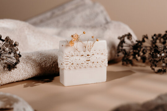 Handmade soap bar with lace and dried flower decoration