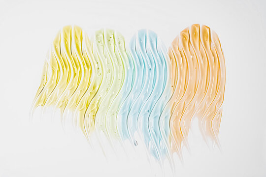 Pastel cosmetic gel smear texture on white background