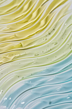Pastel cosmetic gel smear texture with glossy waves