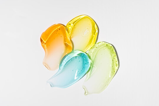 Colorful cosmetic gel smear texture on white background