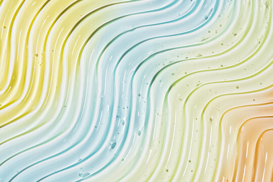 Pastel cosmetic gel smear texture with flowing curved lines