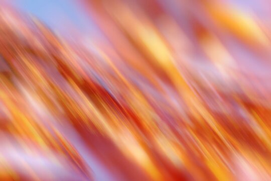 Abstract blurred colorful light streak background in warm tones