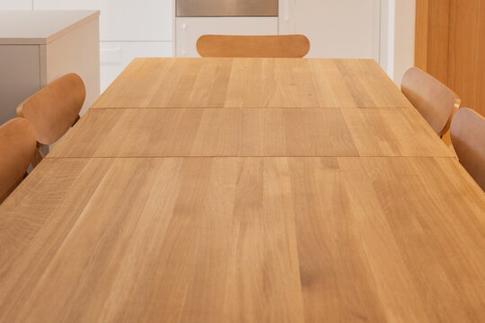 Modern apartment dining table with wooden chair interior