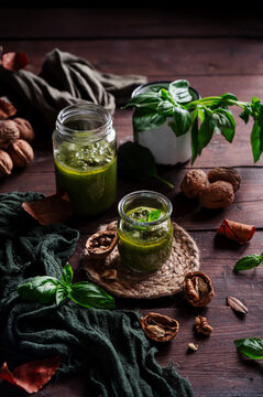 Walnut and basil pesto in rustic glass jars