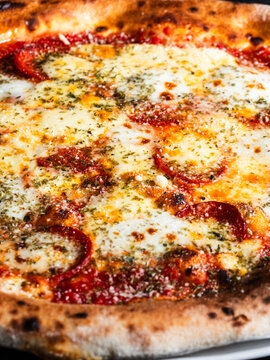 Salami pizza with mozzarella cheese and tomato sauce