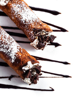 Italian cannoli with ricotta cream and chocolate topping