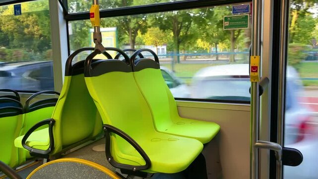Electric bus traveling on an urban route in Milan, Italy, showing an empty passenger cabin and everyday public transportation. 