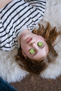 Girl relax with cucumber eye mask at home