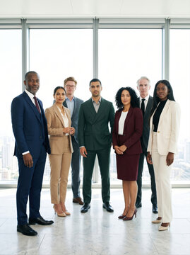 Executives holding a standing meeting on a rooftop terrace