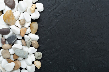 White pebble stones on concrete background, top view © Liami
