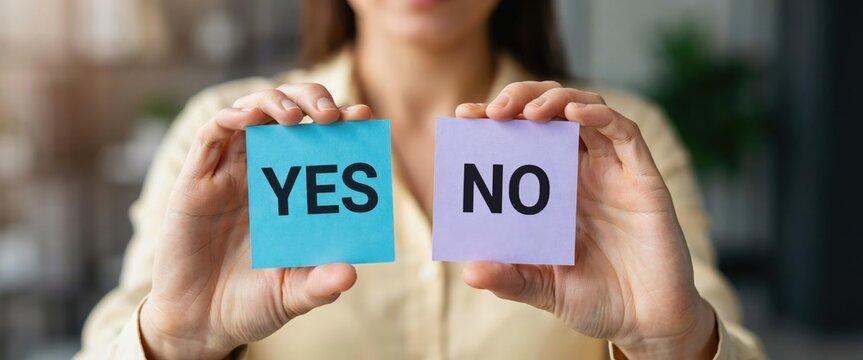 Woman holding two sticky notes, one with "YES" and one with "NO"