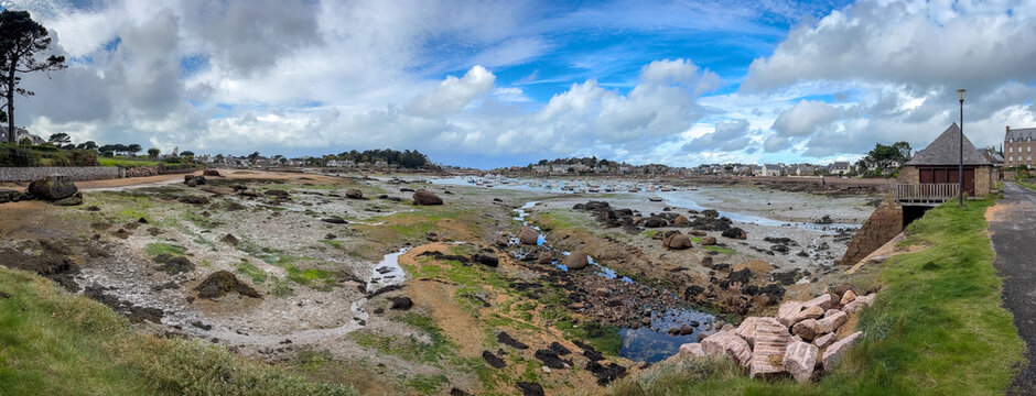 Tidal mill panorama across wide bay in Ploumanach Brittany France