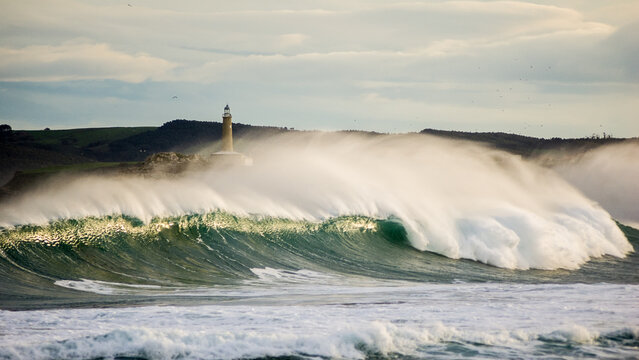 Huge Storm Wave Breaking Near Mouro Island Lighthouse in Santander, Spain