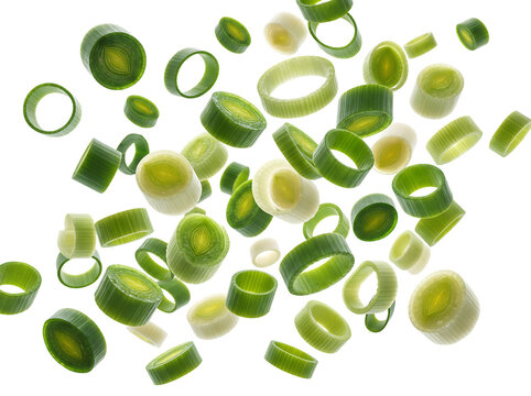 Falling chopped green onion rings, flying sliced spring scallions and leek isolated on transparent background