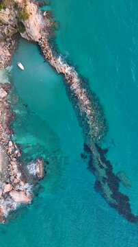 Aerial view of Paralia Fieroulas and rocky coastline, Greece.