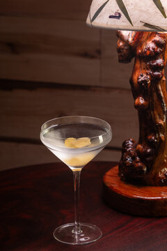 Elegant cocktail in a martini glass. The classic Vesper Martini, stylized background adds moody sophistication. Ideal for upscale bar or cocktail menus
