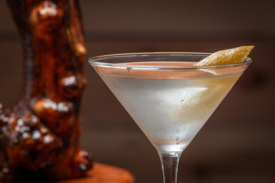 Elegant cocktail in a martini glass. The classic Vesper Martini, stylized background adds moody sophistication. Ideal for upscale bar or cocktail menus