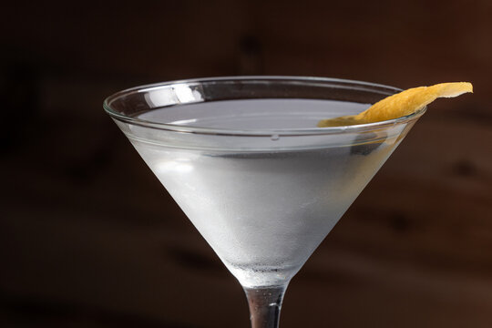 The classic Vesper Martini, served in a tall martini glass on a wooden background.