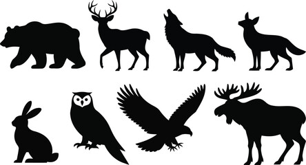 Fototapeta premium Assorted wild animal silhouettes featuring a bear, deer, wolf, fox, rabbit, owl, eagle, and moose isolated on a white background, for wildlife
