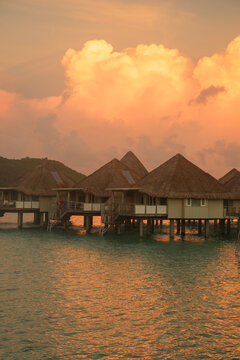 Overwater Bungalows at Golden Sunset in Bora Bora French Polynesia