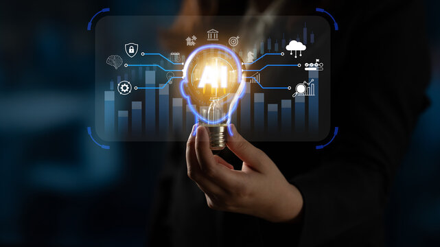 A person holding a glowing light bulb surrounded by digital elements representing data visualization and innovative technology in the business environment. Nascent