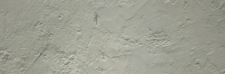 Rough concrete wall texture showing weathered gray plaster surface background © Harry