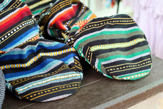 Traditional berets of typical Manchegan male attire for sale in The Fairground of Albacete city