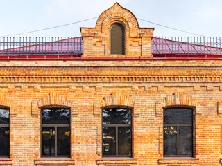Four windows of the old mansion 19 century with brown bricks wall © Dmitrii Potashkin