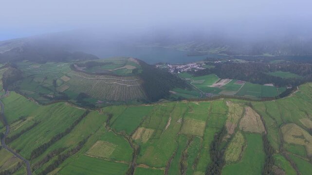 Aerial view of green fields in fog, Portugal.