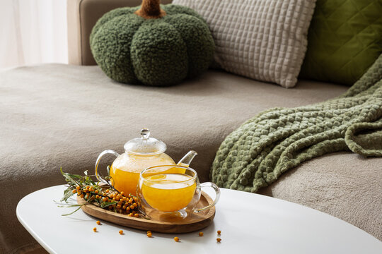 Comforting Autumn Evening Scene With Sea Buckthorn Tea And Cozy Decor Elements