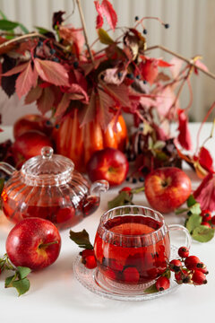 Autumnal Still Life Featuring Red Apples Warm Tea And Vibrant Fall Leaves