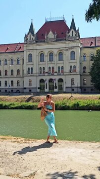 Woman traveler posing by river in Zrenjanin Serbia