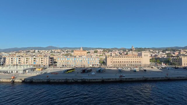 28 April 2026 Italy, Sicily, Strait of Messina, Via Vitorrio Emanuele II - timelapse of ship shadow on houses arriving at cruise terminal