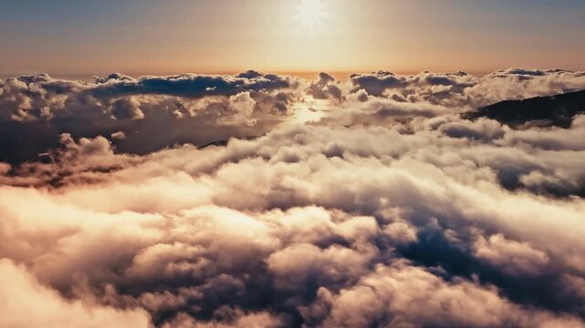 Sunlight illuminates billowing clouds over Madeira, Portugal, in a sweeping drone view