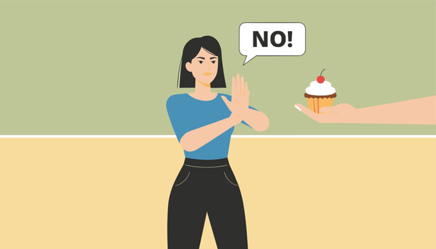 Young woman making a stop gesture with her hand and saying no to someone offering her a sweet cupcake with a cherry on top.