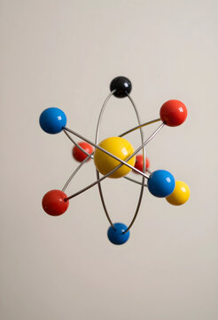 Science and education concept, atomic structure model with colorful spheres protons and electrons for physics research and chemistry study